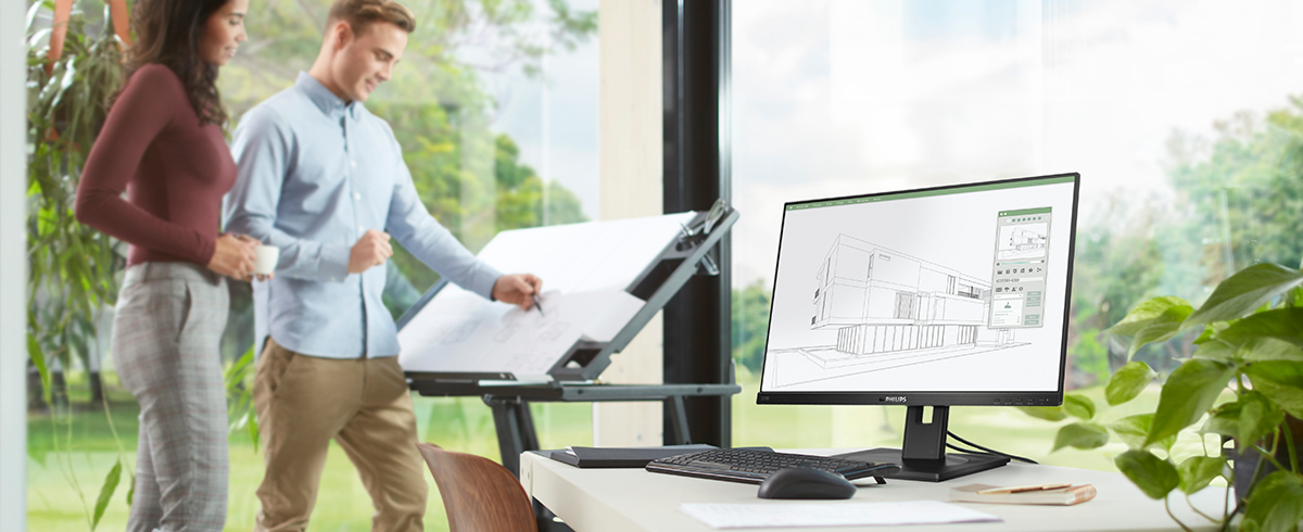 Las personas disfrutan del lugar de trabajo con los monitores verdes y de bajo impacto de Philips.