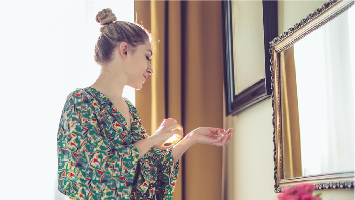 Lady spraying perfume